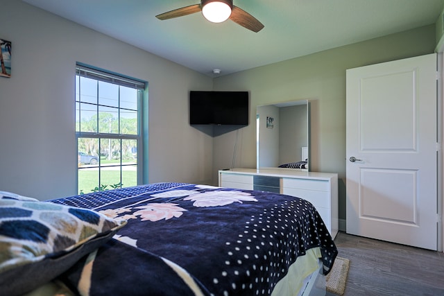 bedroom featuring dark wood-type flooring and ceiling fan