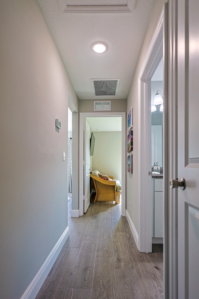 corridor featuring hardwood / wood-style flooring