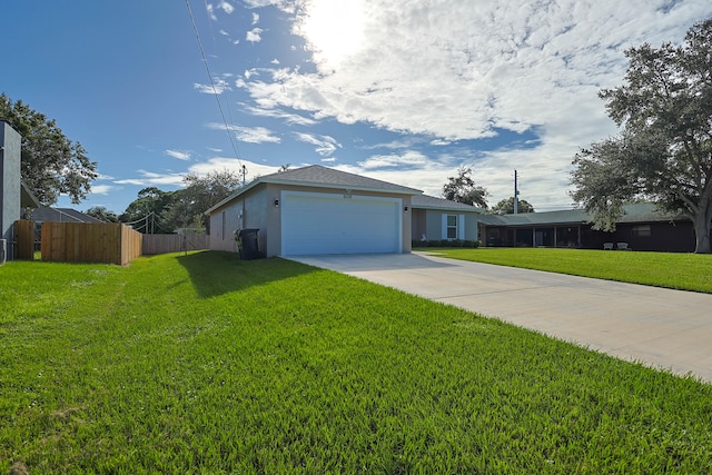 view of front of house featuring a garage and a front lawn