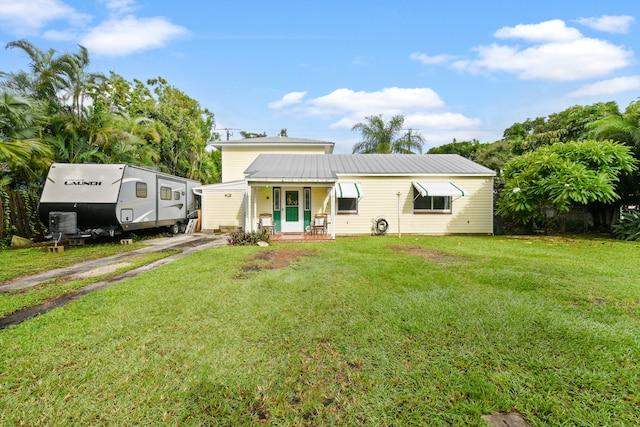 view of front of home featuring a front yard and a porch