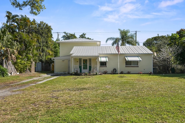 view of front of property with a porch and a front lawn