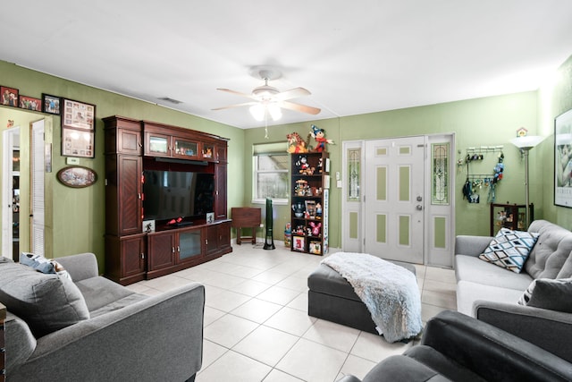 tiled living room featuring ceiling fan