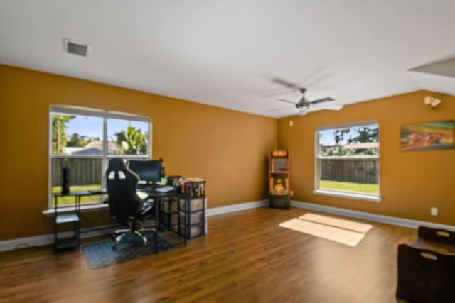 office space with plenty of natural light, hardwood / wood-style floors, and ceiling fan