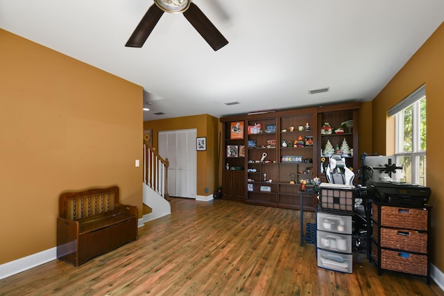 office featuring dark wood-type flooring and ceiling fan