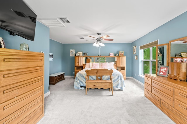 bedroom with light carpet and ceiling fan