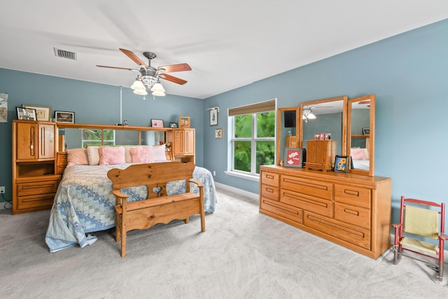 bedroom featuring ceiling fan and light colored carpet