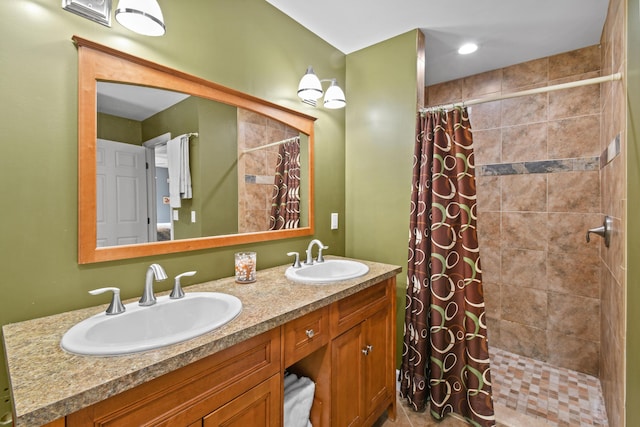 bathroom featuring vanity and curtained shower