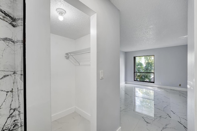 bathroom featuring a textured ceiling