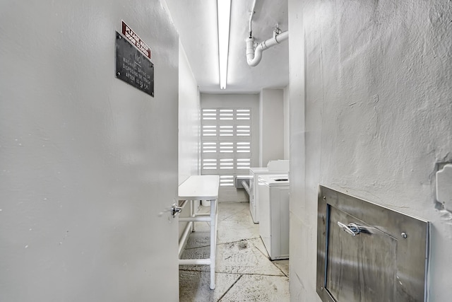 interior space with washing machine and clothes dryer