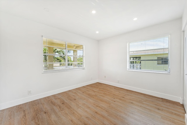 spare room with light wood-type flooring