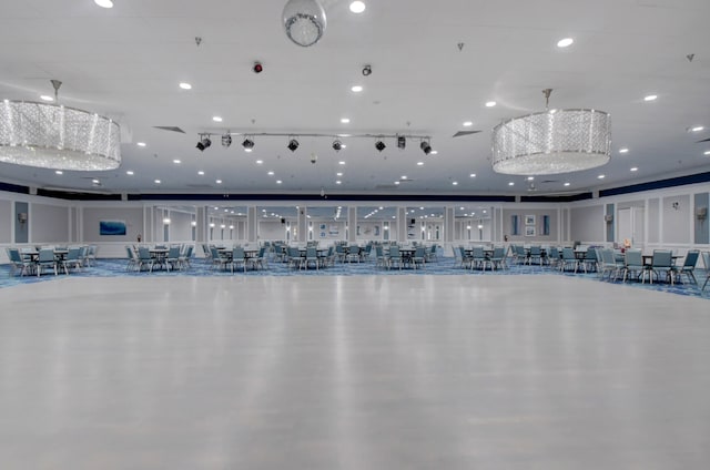 gym with a chandelier