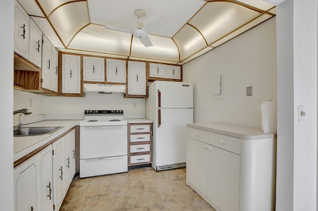 kitchen with white appliances, ceiling fan, white cabinetry, and sink