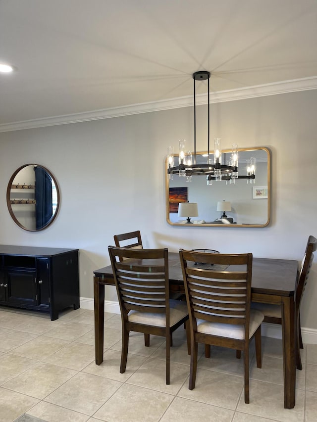 dining room with baseboards, a notable chandelier, and ornamental molding