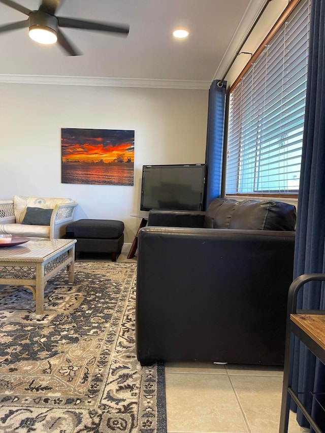 living room featuring ornamental molding and ceiling fan