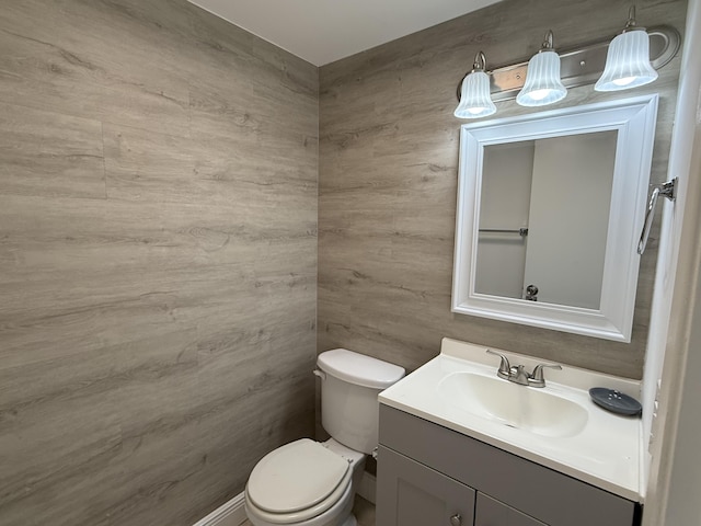 bathroom with toilet and vanity