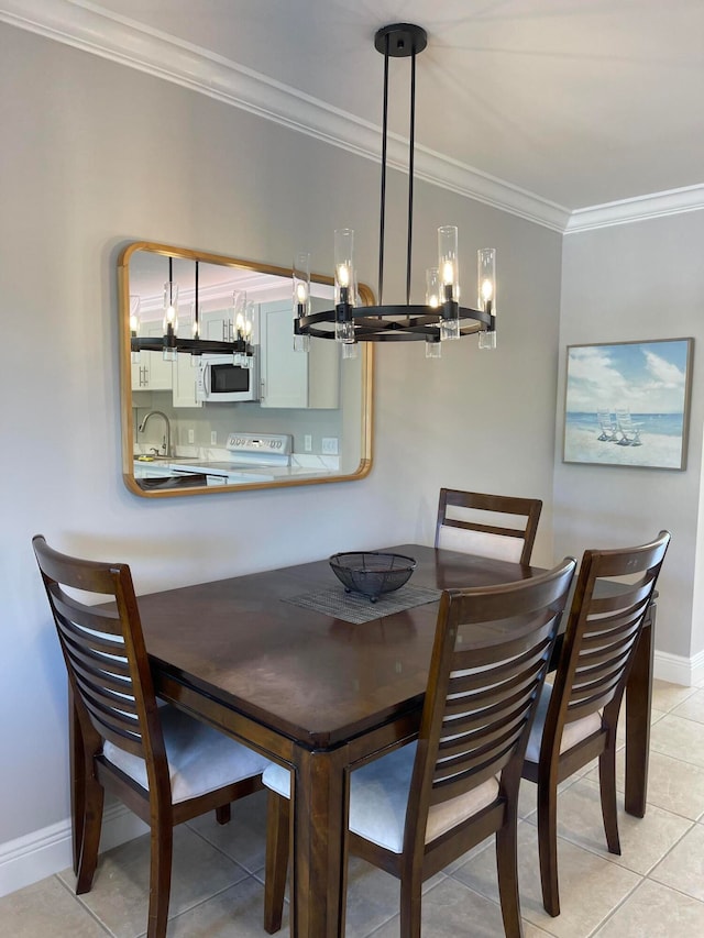 tiled dining space featuring sink and crown molding