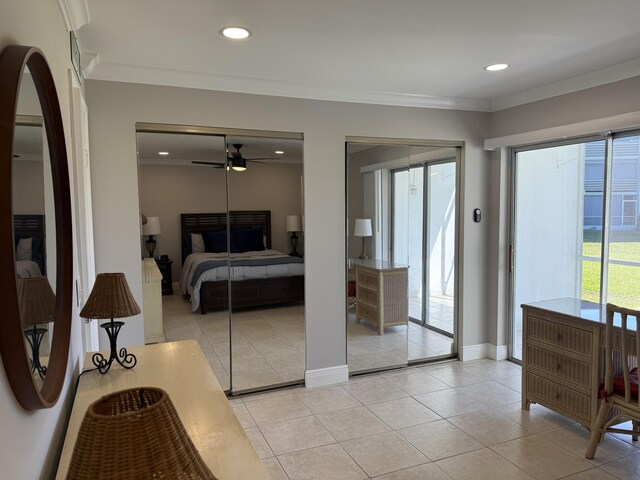 bedroom with ornamental molding, multiple closets, access to exterior, recessed lighting, and light tile patterned floors