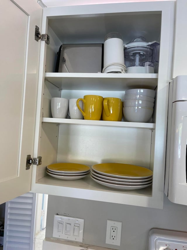 interior details featuring white cabinets