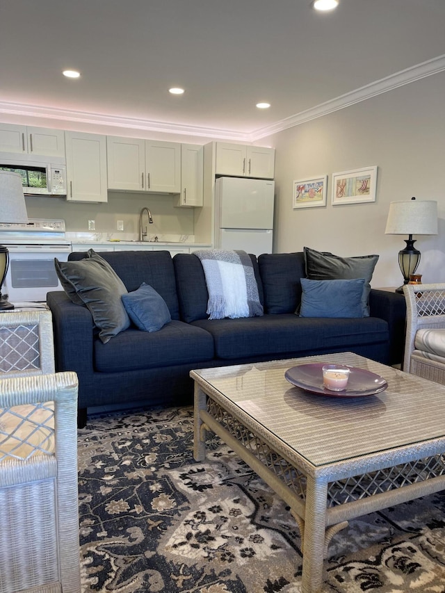 living room featuring recessed lighting and ornamental molding
