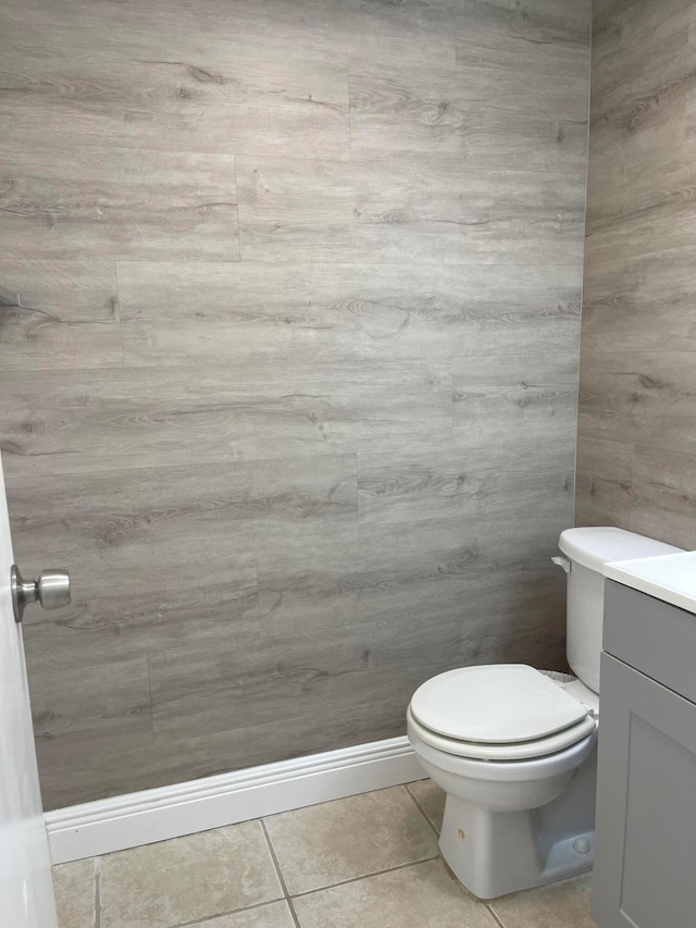 bathroom featuring vanity, toilet, and tile patterned floors