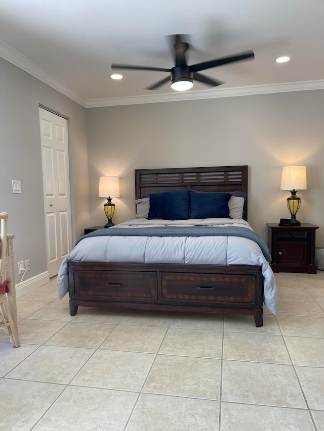 bedroom featuring light tile patterned floors, ornamental molding, ceiling fan, and a closet