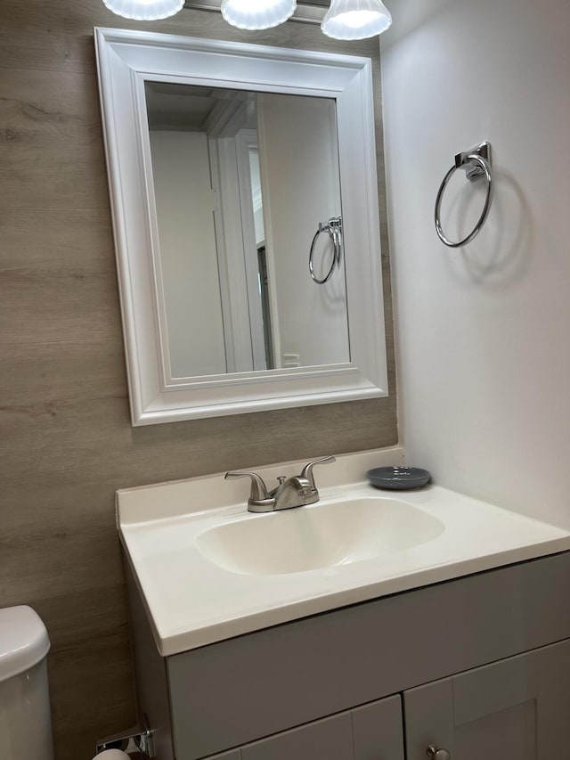 bathroom featuring toilet and vanity