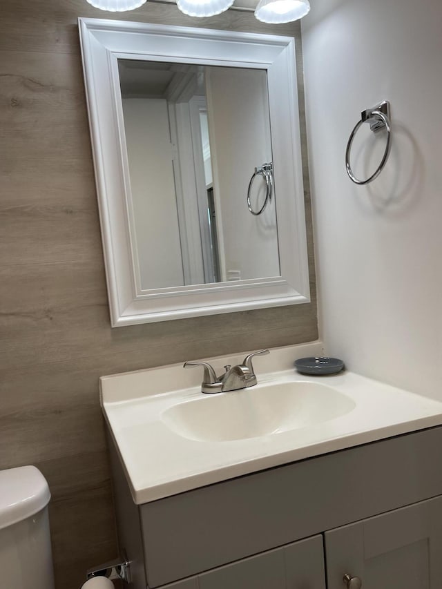 half bath with vanity and toilet