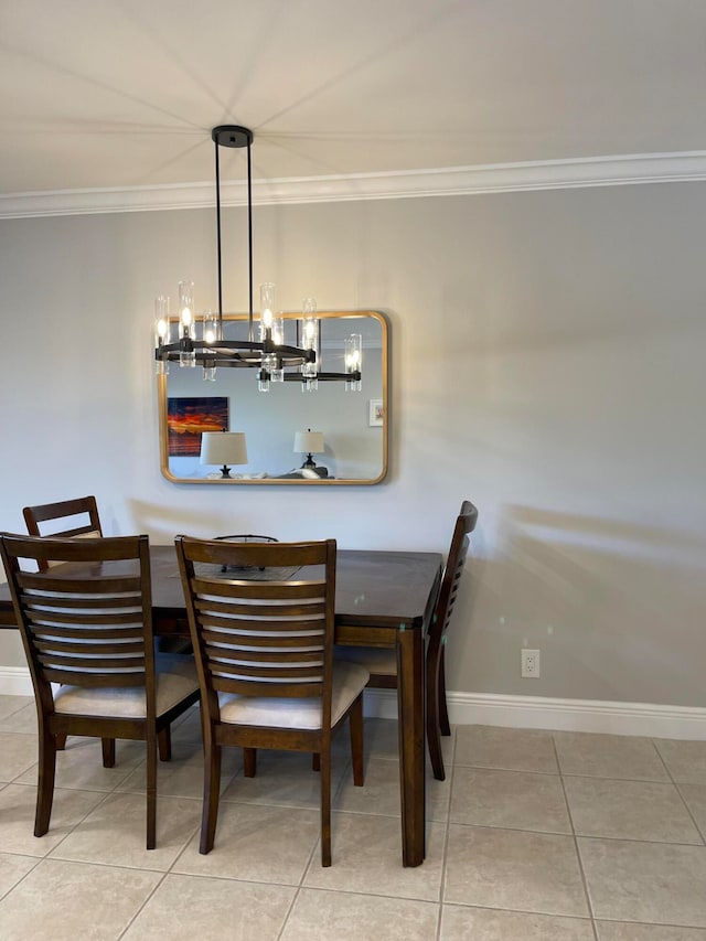 tiled dining space with an inviting chandelier and crown molding