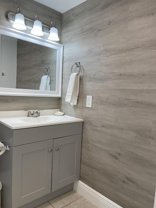 bathroom with tile patterned flooring and vanity