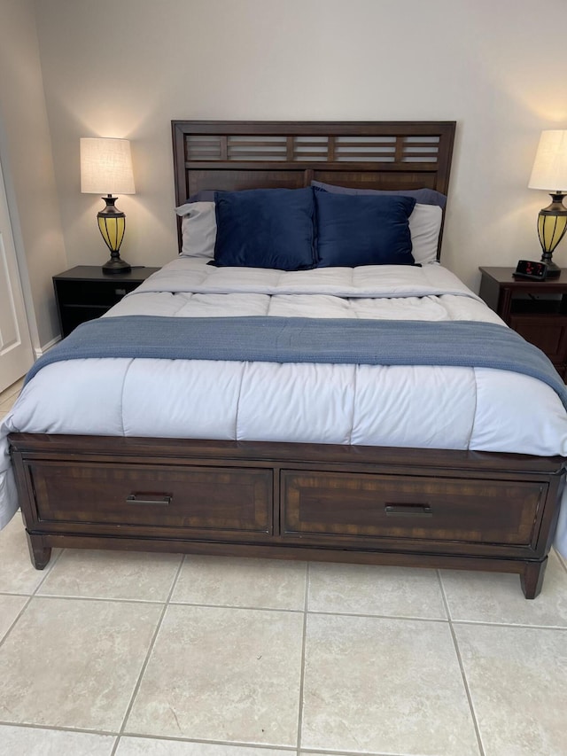 bedroom featuring light tile patterned flooring