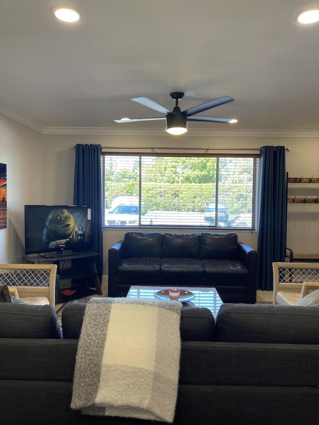living room featuring crown molding, a ceiling fan, and recessed lighting