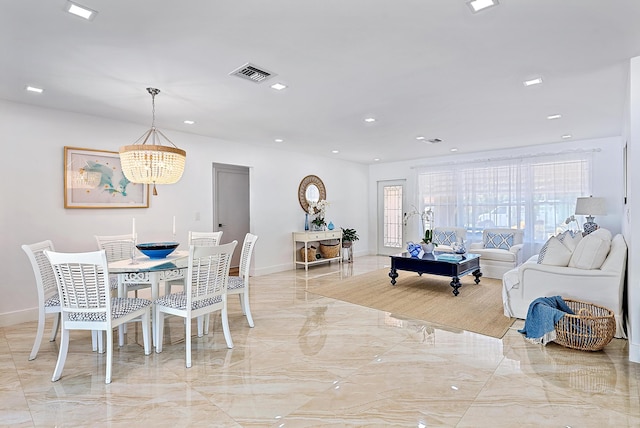 dining space featuring a chandelier