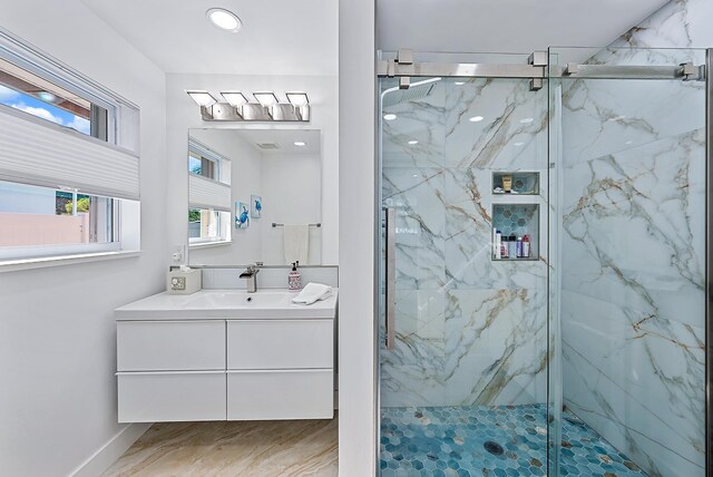 bathroom featuring vanity and walk in shower