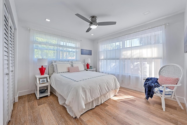 bedroom featuring ceiling fan and light wood-type flooring