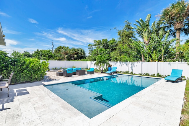 view of pool with outdoor lounge area and a patio area