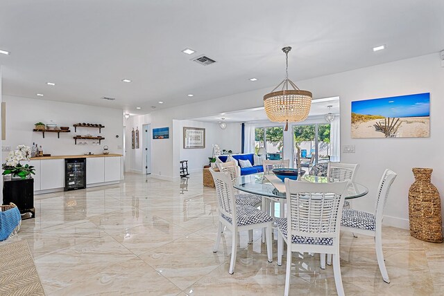 dining room with bar area and beverage cooler