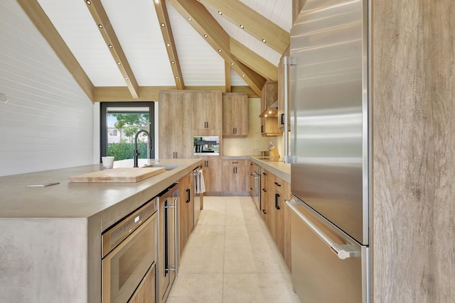 11880 Pebblewood Dr, Wellington, FL 33414 - kitchen with stainless steel refrigerator, light brown cabinets, a sink, light countertops, and light tile patterned floors