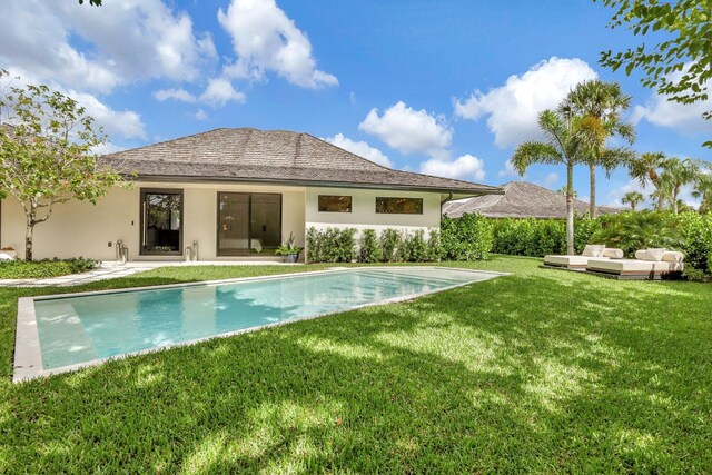 11880 Pebblewood Dr, Wellington, FL 33414 - back of property with an outdoor hangout area, stucco siding, a yard, and an outdoor pool