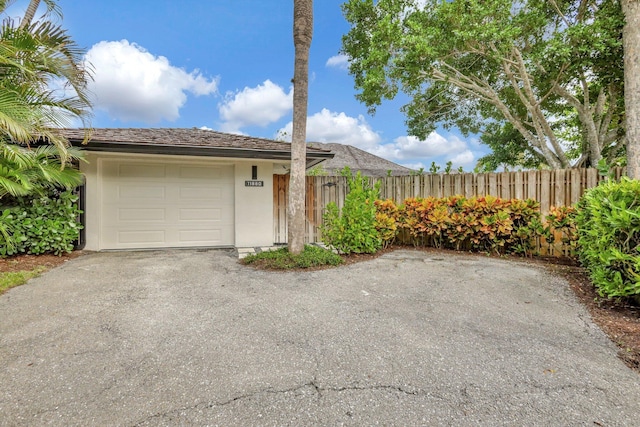 ranch-style home with a garage