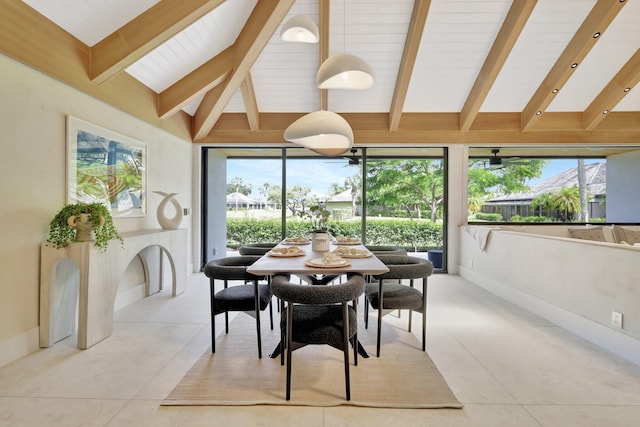 dining space featuring vaulted ceiling with beams and light tile patterned floors