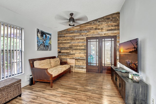 living area with plenty of natural light and lofted ceiling