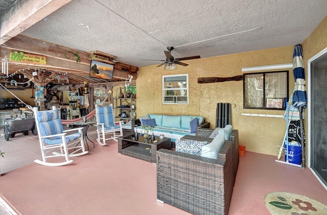 view of patio with outdoor lounge area and ceiling fan