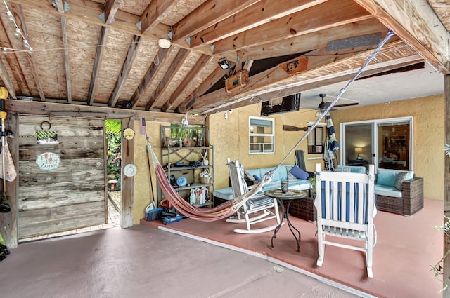 interior space featuring ceiling fan and an outdoor hangout area