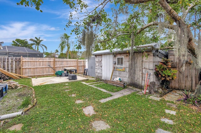 view of yard with a patio area and an outbuilding