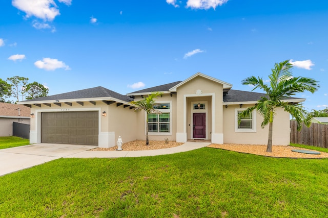 view of front of home featuring a front yard and a garage