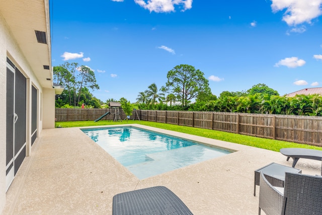 view of swimming pool with a patio area