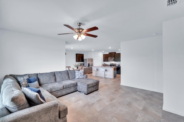 living room featuring ceiling fan