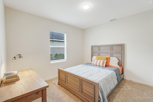 bedroom with light carpet