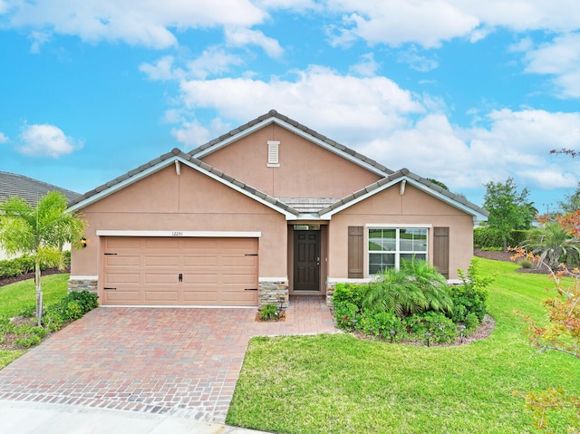 single story home featuring a front yard and a garage