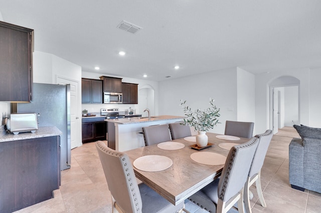 tiled dining area with sink